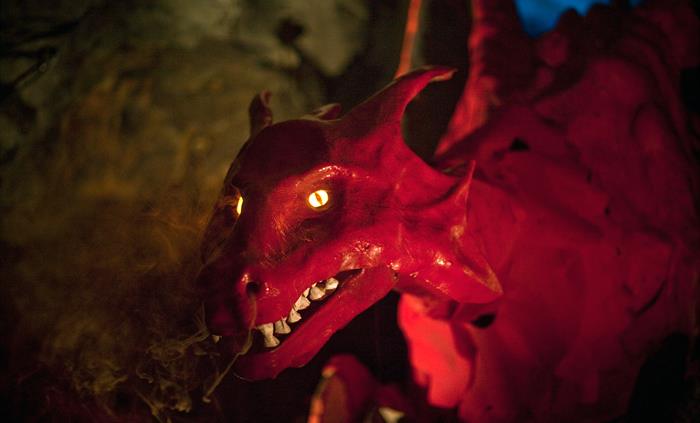 Image of a red dragon at King Arthur's Labyrinth in Corris